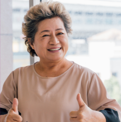 woman giving thumbs up with both hands