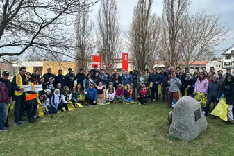 group photo of people with garbage bags
