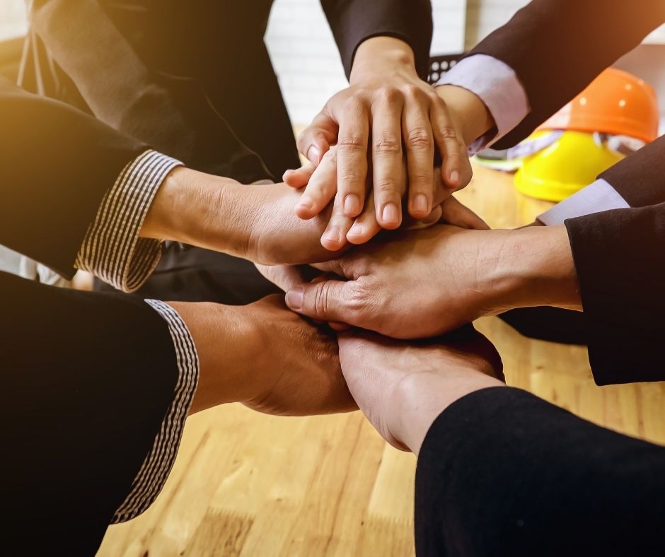 Hands stacked together