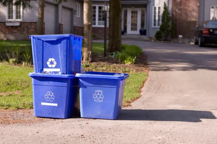 3 blue bins at curb