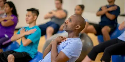 Fitness class featuring a male participant