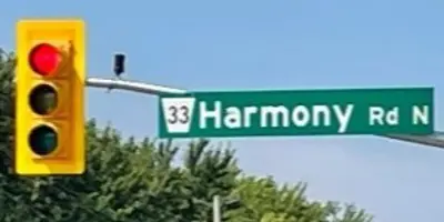 red traffic light with green street sign