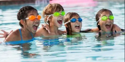 Youth swimmers wearing swim goggles