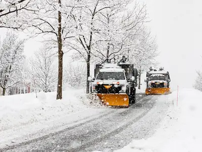 Loader on the street clearing snow
