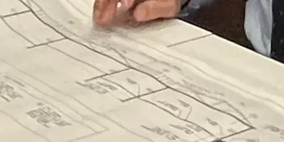 man hand on blue prints