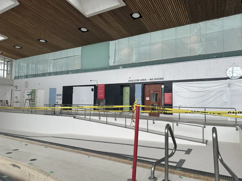 Yellow caution tape around empty South Oshawa Community Centre pool