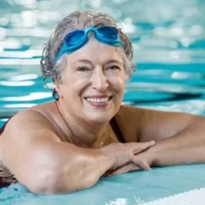 Woman in pool with goggles