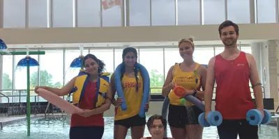 Lifeguards standing on pool deck at South Oshawa Community Centre Pool 