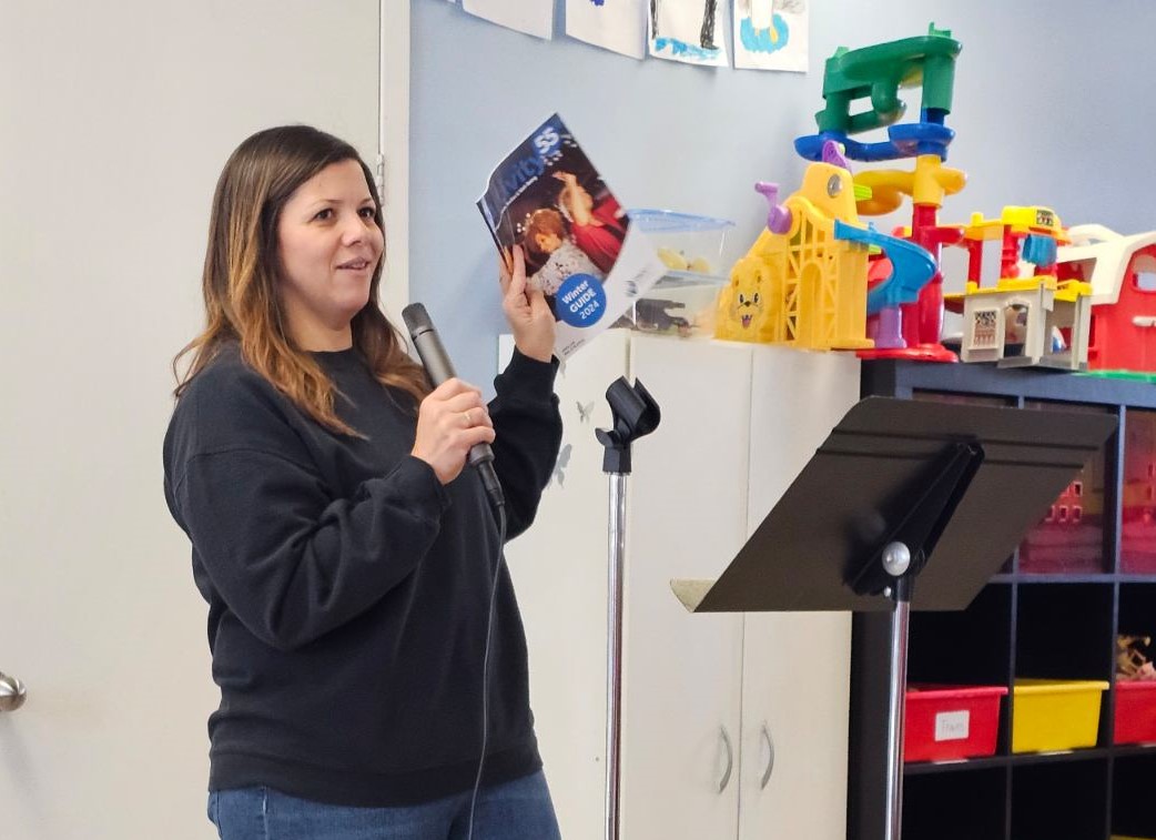 woman displaying the leisure guide