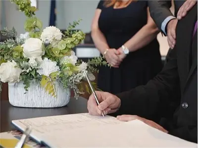 Signing the marriage register book